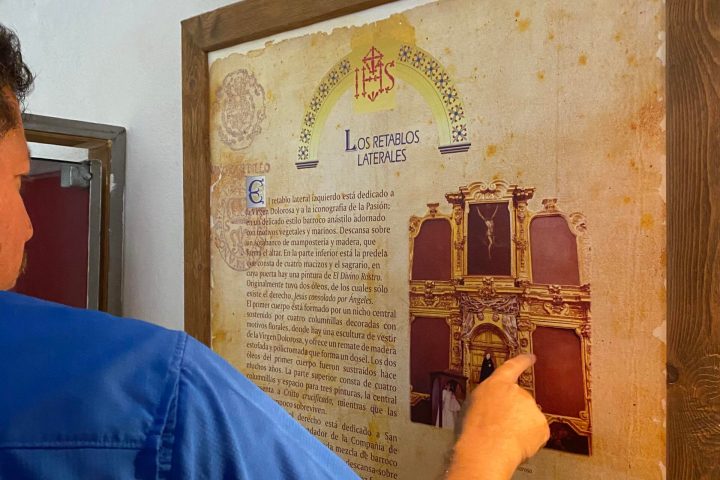 a man standing in front of a mirror posing for the camera