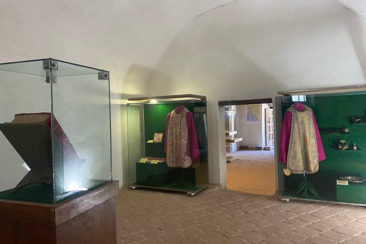 a bedroom with a bed and a mirror