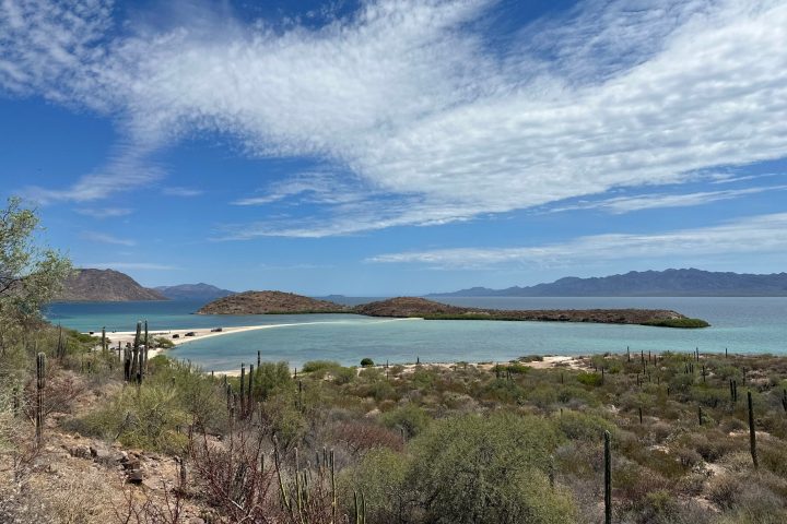 a view of a beach next to a body of water